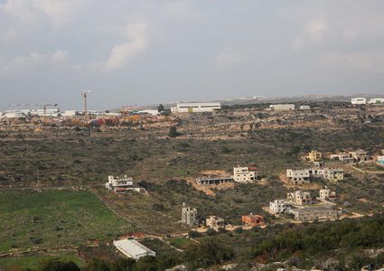 Israeli settlers place a mobile home south of Nablus