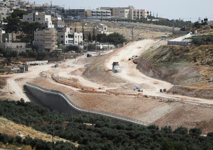 New settlement roads,cement blocks on the main entrances of West Bank villages to facilitate annexation
