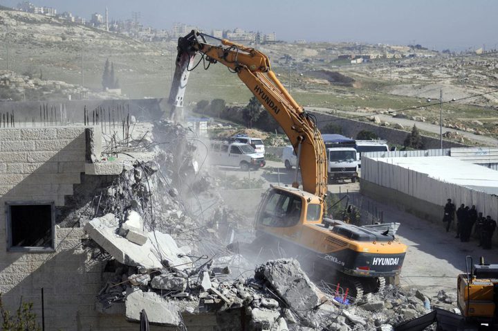 Jerusalem :Israeli bulldozers demolish a Palestinian owned building