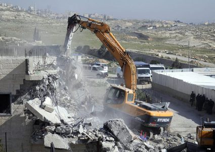 Jerusalem :Israeli bulldozers demolish a Palestinian owned building