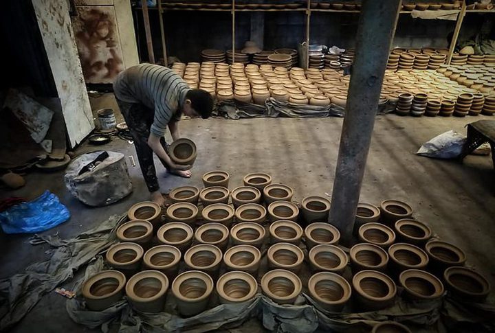 The manufacture of pottery vessels in various shapes and sizes at the "Suleiman Atallah" factory, east of Deir Al-Balah, in the middle of the Gaza Strip.